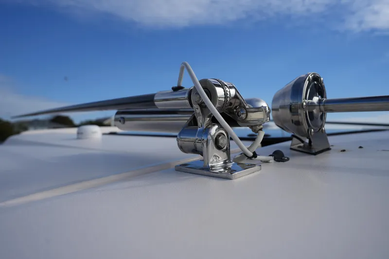 Slide: The Image of Close-up of 2024 Grady-White Express 330 boat's metal fittings under a clear sky. - 73