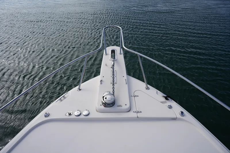 Slide: The Image of Bow view of 2024 Grady-White Express 330 on calm water. - 77