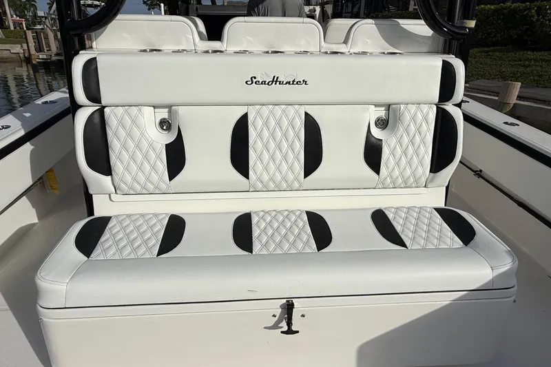 Slide: The Image of 2020 SeaHunter 41 CTS boat storage compartment with organized fishing gear and supplies. - 25