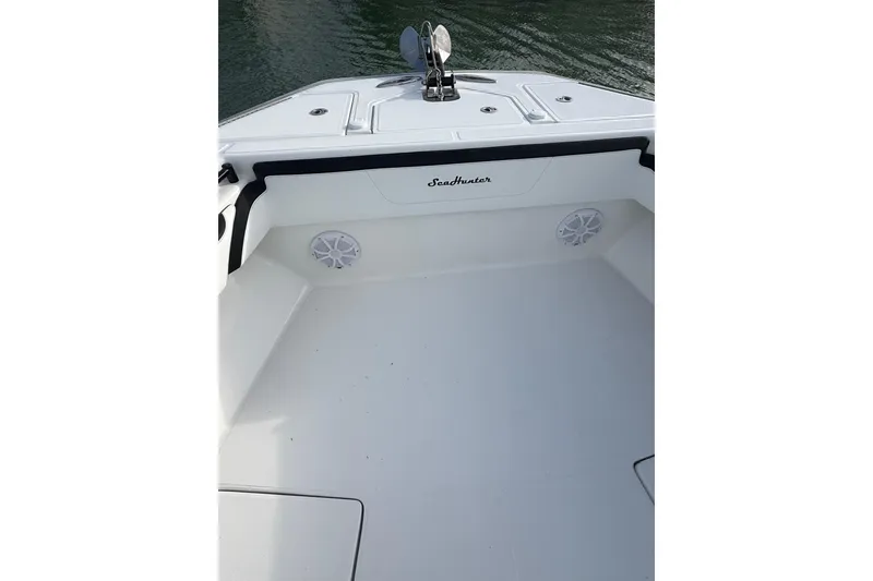 Slide: The Image of 2020 SeaHunter 41 CTS boat with open storage compartment, sleek design, and waterfront view. - 29