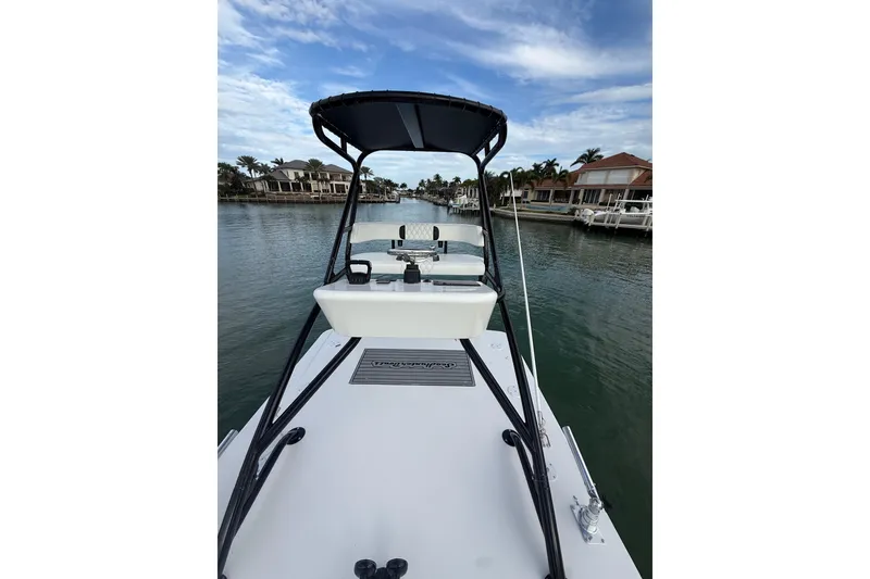 Slide: The Image of 2020 SeaHunter 41 CTS boat interior with luxurious white seating and scenic waterfront view. - 35