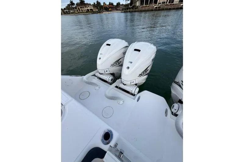 Slide: The Image of 2020 SeaHunter 41 CTS boat detail with water and palm trees in the background. - 37