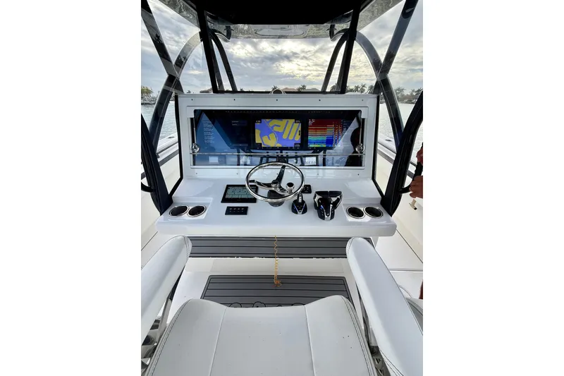 Slide: The Image of 2020 SeaHunter 41 CTS boat dashboard with modern navigation and control systems. - 39