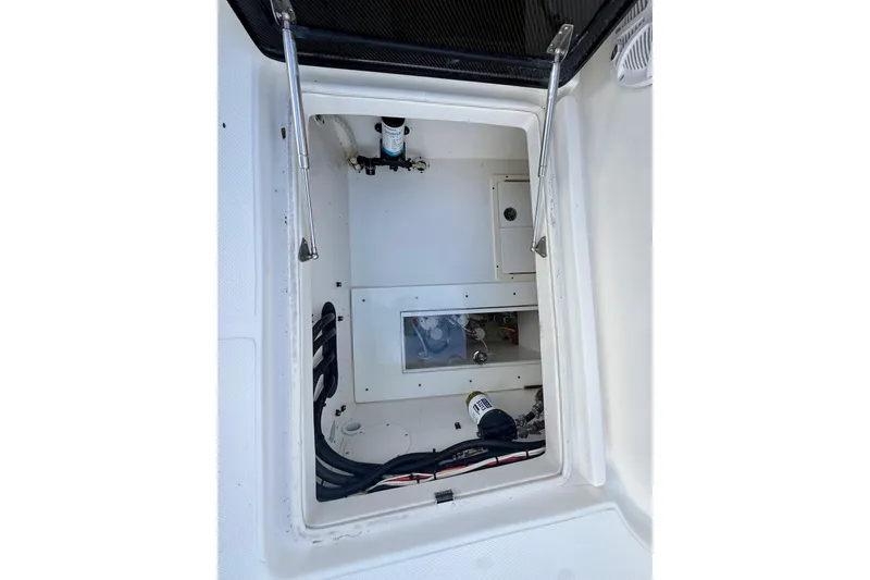 Slide: The Image of 2020 SeaHunter 41 CTS boat compartment with visible wiring and components. - 45