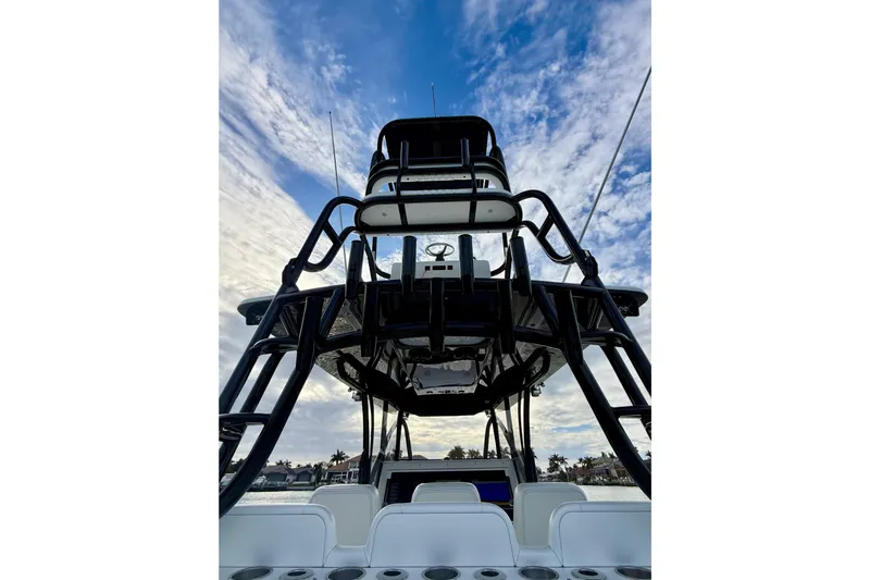 Slide: The Image of 2020 SeaHunter 41 CTS boat with tower against a cloudy sky backdrop. - 49