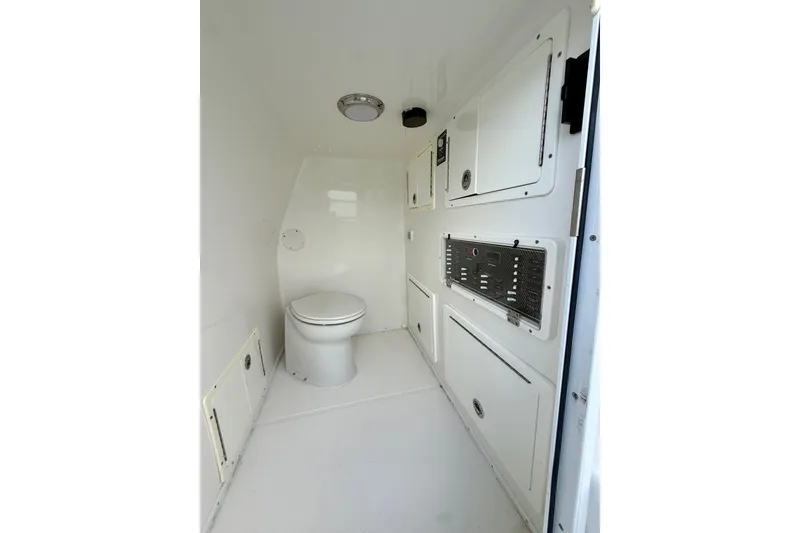 Slide: The Image of 2020 SeaHunter 41 CTS boat interior with toilet and storage compartments. - 51