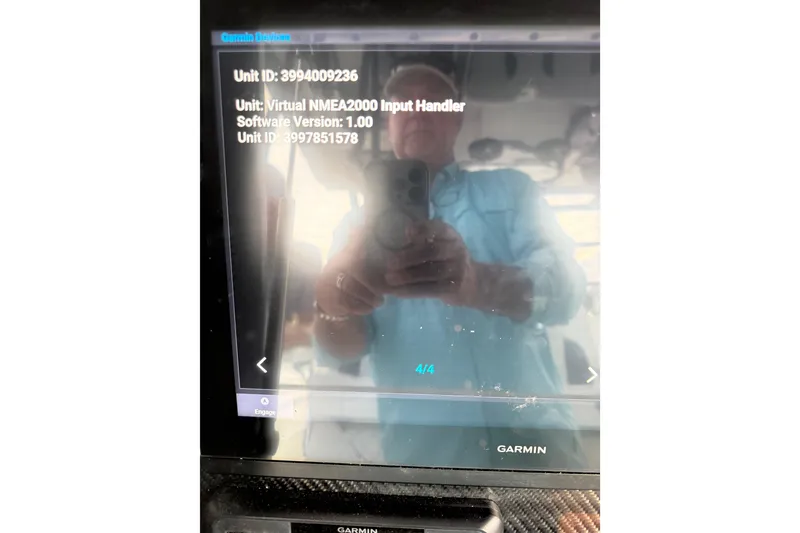 Slide: The Image of Garmin device screen on 2020 SeaHunter 41 CTS boat displaying unit information. - 52