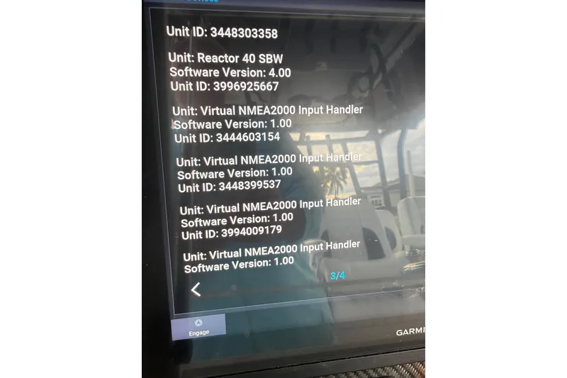 Slide: The Image of Display screen showing software versions and unit IDs on a 2020 SeaHunter 41 CTS boat. - 53