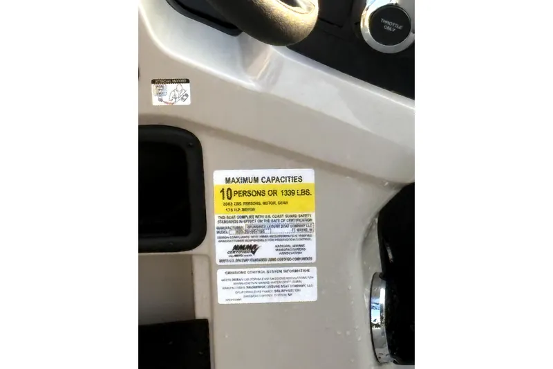 Slide: The Image of Capacity label on 2025 Harris Breeze 230 boat, indicating 10-person or 1,399 lbs limit. - 6