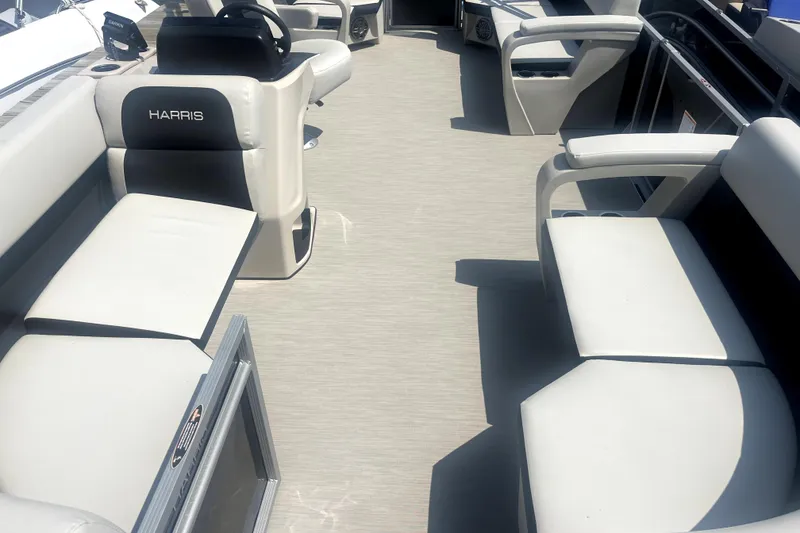 Slide: The Image of 2025 Harris Breeze 230 boat interior with spacious seating and modern design. - 6