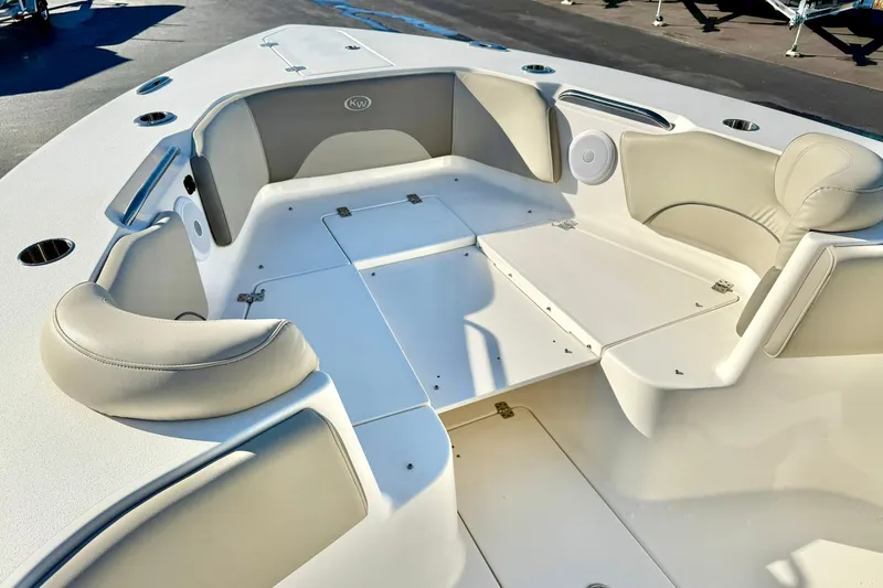 Slide: The Image of 2021 Key West 263 FS boat interior with cushioned seating and storage compartments. - 11