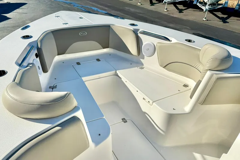 Slide: The Image of 2021 Key West 263 FS boat interior with cushioned seating and storage compartments. - 12