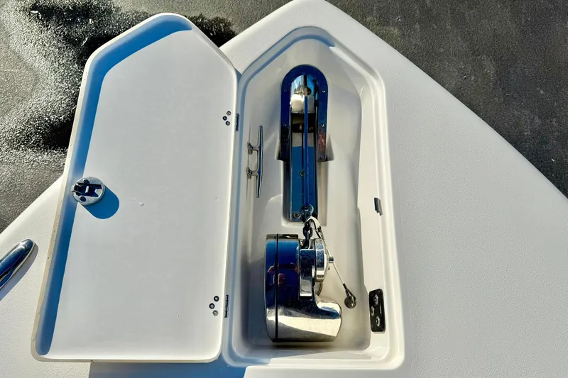 Slide: The Image of 2021 Key West 263 FS boat anchor compartment with stainless steel hardware. - 15