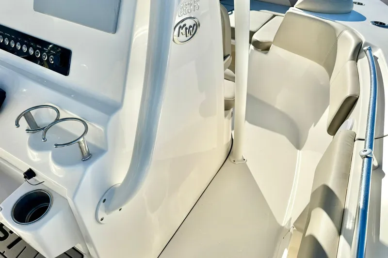 Slide: The Image of 2021 Key West 263 FS boat interior with seating and cup holders. - 19