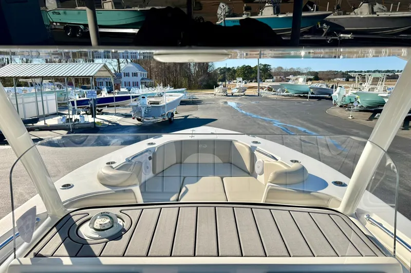 Slide: The Image of 2021 Key West 263 FS boat interior view at a marina. - 21
