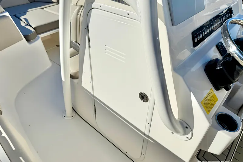 Slide: The Image of 2021 Key West 263 FS boat interior with steering console and seating area. - 22