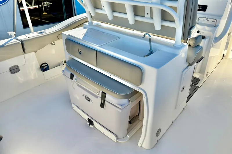 Slide: The Image of 2021 Key West 263 FS boat interior with sink and storage area. - 26