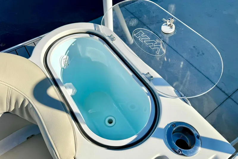 Slide: The Image of Livewell on 2021 Key West 263 FS boat with open lid and seating. - 33