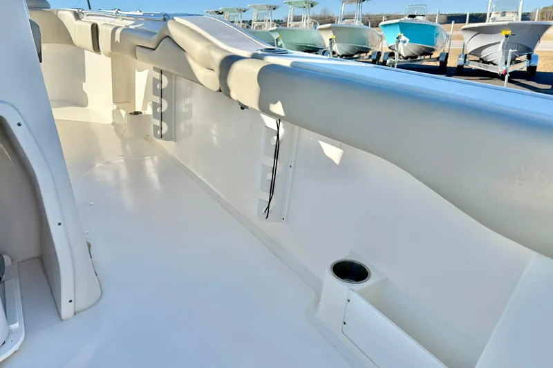 Slide: The Image of 2021 Key West 263 FS boat interior with seating and cup holder. - 34