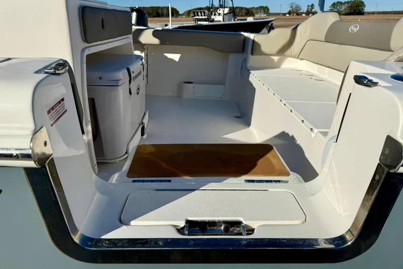 Slide: The Image of 2021 Key West 263 FS boat interior with seating and storage compartments. - 38