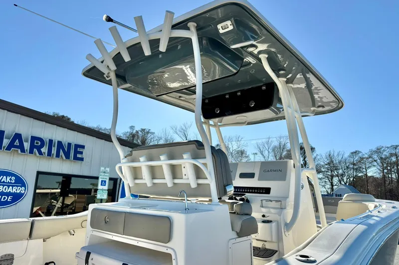Slide: The Image of 2021 Key West 263 FS boat with T-top and Garmin electronics at a marine dealership. - 41