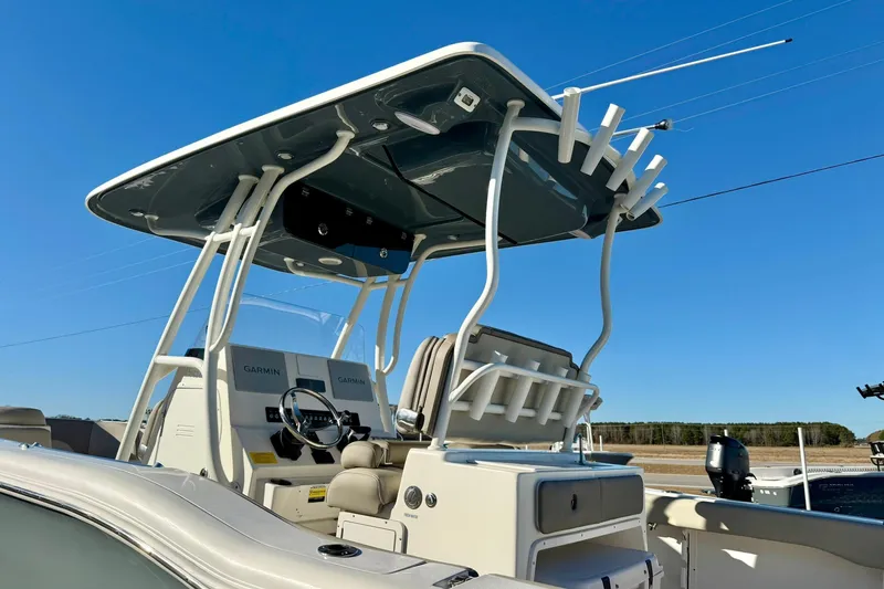 Slide: The Image of 2021 Key West 263 FS boat with T-top and Garmin electronics under clear blue sky. - 42