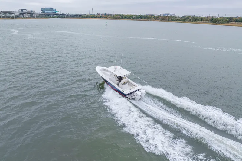 Slide: The Image of Aerial view of 2008 Jupiter 31 FS boat cruising on a calm river. - 18