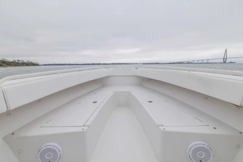Slide: The Image of 2008 Jupiter 31 FS boat bow view with bridge and cloudy sky in background. - 22