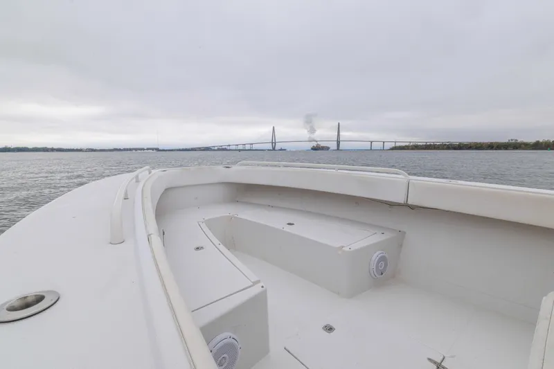 Slide: The Image of 2008 Jupiter 31 FS boat on water with bridge and ship in background. - 23