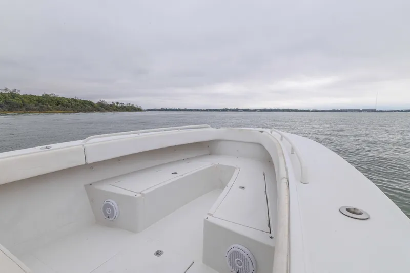 Slide: The Image of 2008 Jupiter 31 FS boat on calm water with overcast sky. - 24