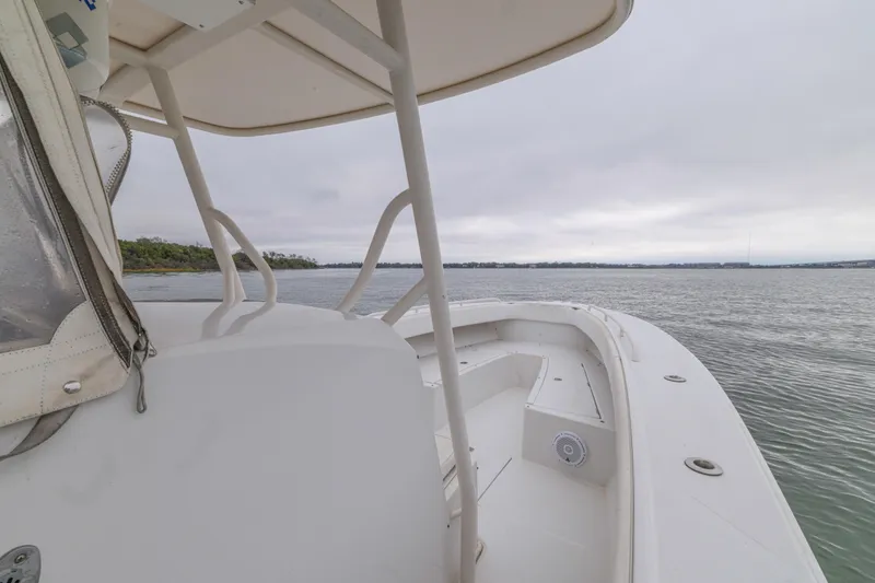 Slide: The Image of 2008 Jupiter 31 FS boat on calm waters under overcast sky. - 25