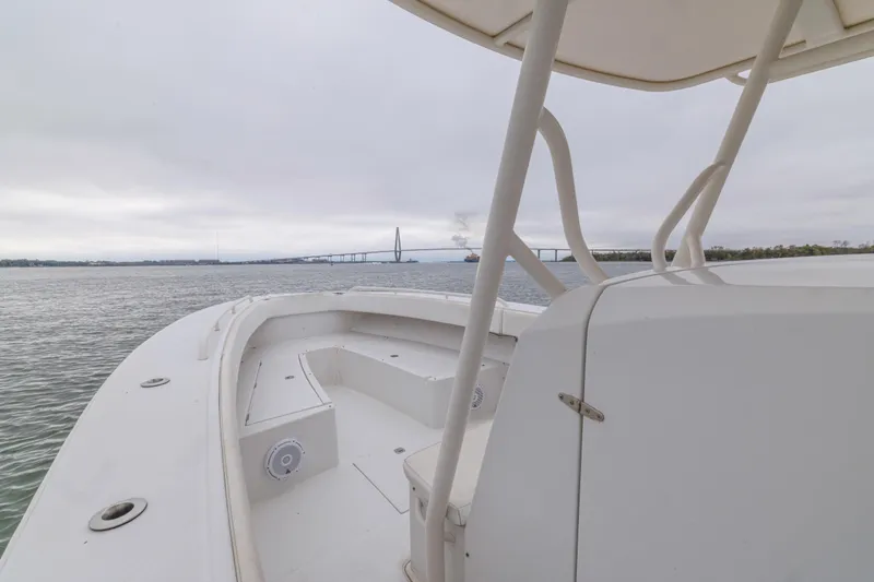 Slide: The Image of 2008 Jupiter 31 FS boat on water with bridge in background. - 26