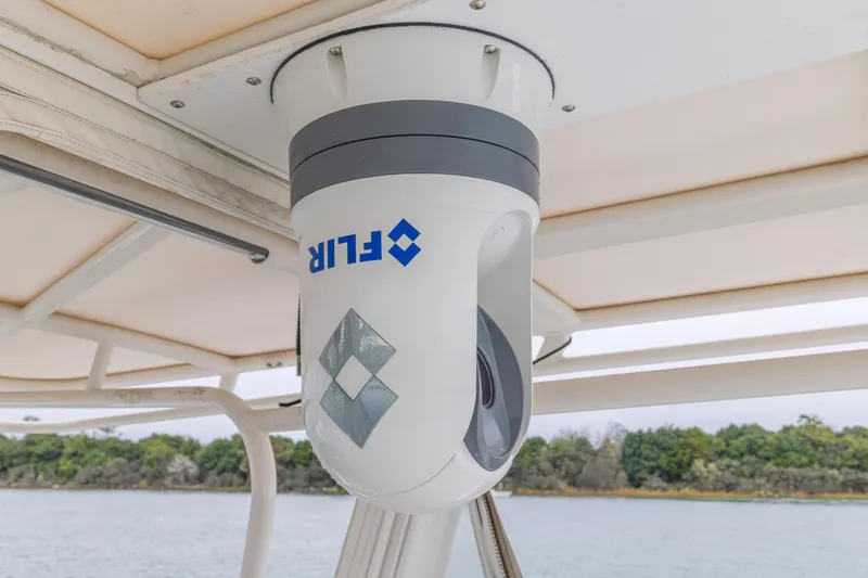 Slide: The Image of FLIR camera mounted on a 2008 Jupiter 31 FS boat, under a canopy. - 29