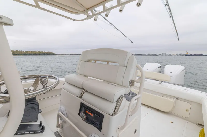 Slide: The Image of 2008 Jupiter 31 FS boat interior with helm, seating, and ocean view. - 35