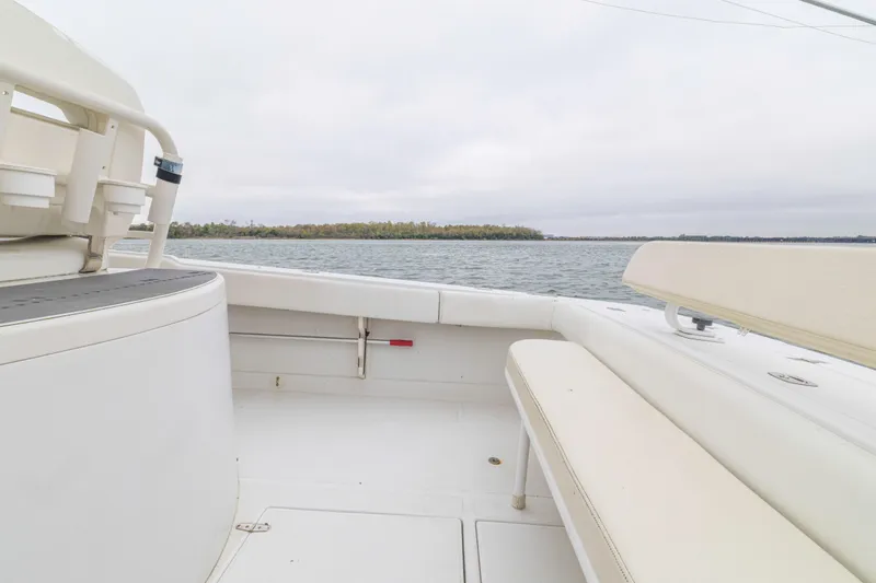 Slide: The Image of 2008 Jupiter 31 FS boat interior with seating, overlooking calm waters and distant shoreline. - 38