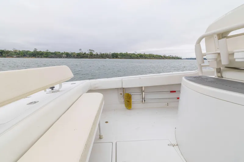Slide: The Image of 2008 Jupiter 31 FS boat interior with seating, overlooking calm waters and distant shoreline. - 39