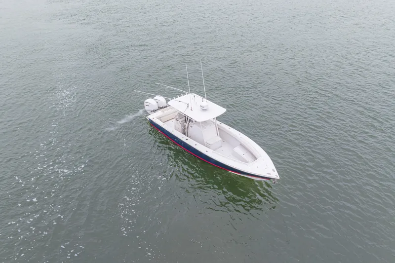 Slide: The Image of 2008 Jupiter 31 FS boat cruising on open water, aerial view. - 9