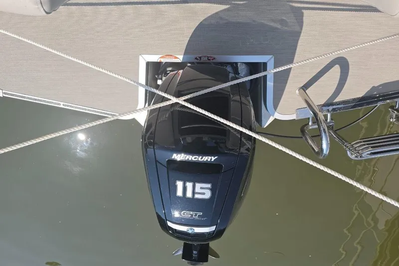 Slide: The Image of Mercury 115 outboard motor on 2025 Harris Breeze 230 pontoon boat, docked. - 10