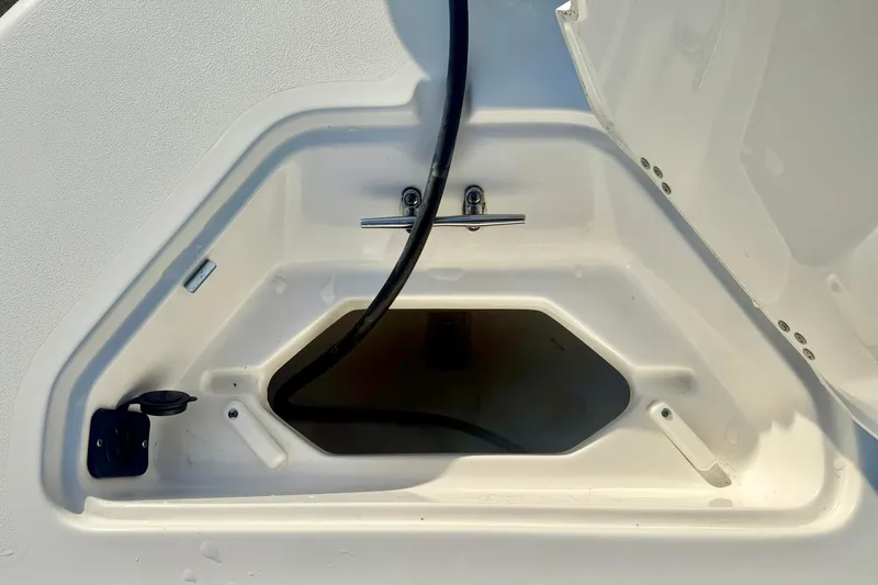 Slide: The Image of Open storage compartment on 2024 Key West 203 FS boat. - 14