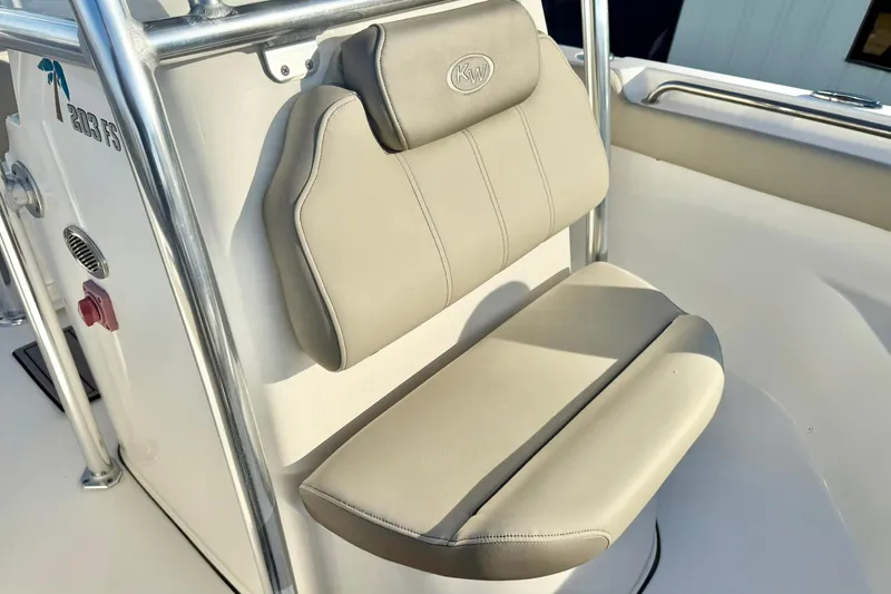 Slide: The Image of 2024 Key West 203 FS boat seat with beige upholstery and stainless steel frame. - 16