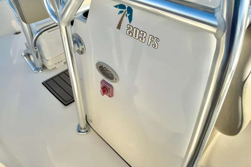 Slide: The Image of 2024 Key West 203 FS boat interior with console details and stainless steel railing. - 18