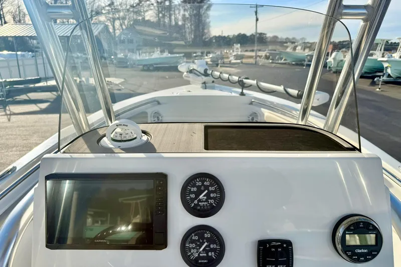 Slide: The Image of 2024 Key West 203 FS boat dashboard with navigation instruments and gauges. - 19