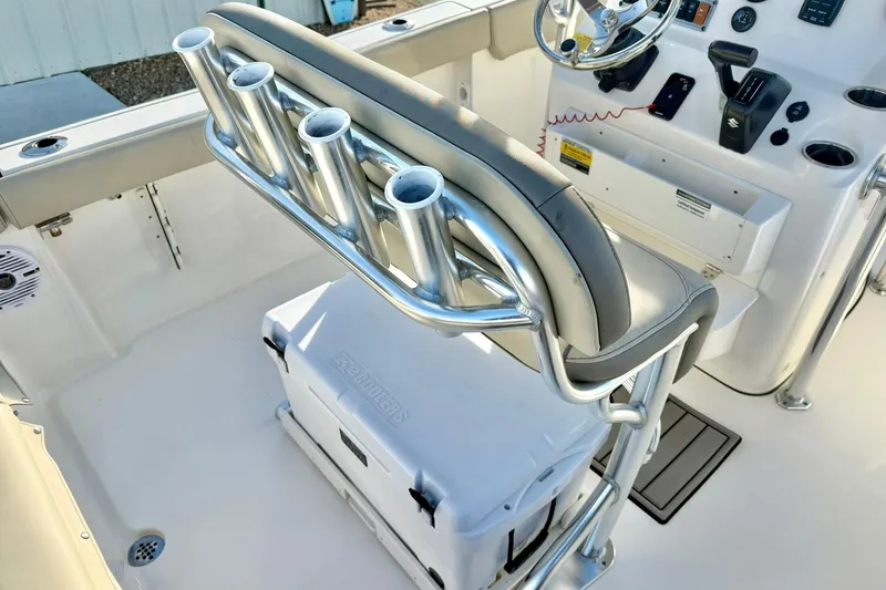 Slide: The Image of 2024 Key West 203 FS boat interior with rod holders and steering console. - 25