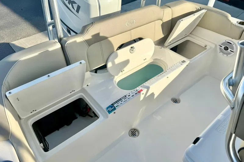 Slide: The Image of 2024 Key West 203 FS boat interior with storage compartments and seating. - 29