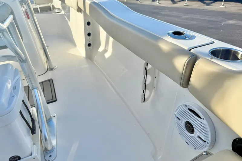 Slide: The Image of 2024 Key West 203 FS boat interior with seating, cup holders, and speaker. - 33