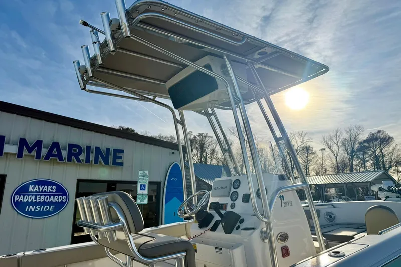 Slide: The Image of 2024 Key West 203 FS boat at marine dealership under sunny sky. - 37
