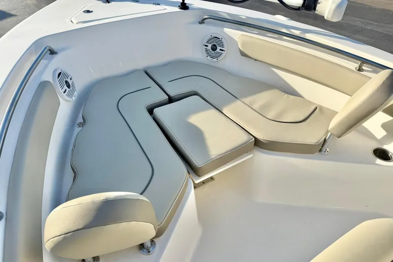 Slide: The Image of 2024 Key West 203 FS boat interior with cushioned seating and speakers. - 9