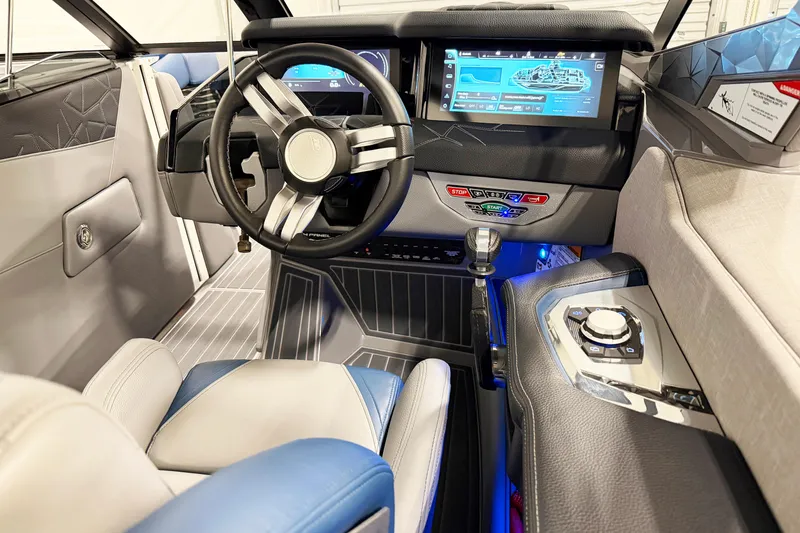 Slide: The Image of 2022 Nautique Super Air Nautique G23 Paragon cockpit with advanced controls and digital display. - 11
