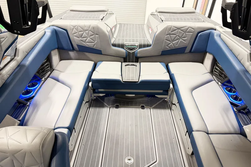 Slide: The Image of 2022 Nautique Super Air Nautique G23 Paragon interior with luxurious seating and ambient lighting. - 14