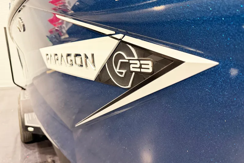 Slide: The Image of 2022 Nautique Super Air Nautique G23 Paragon logo on blue boat exterior. - 4